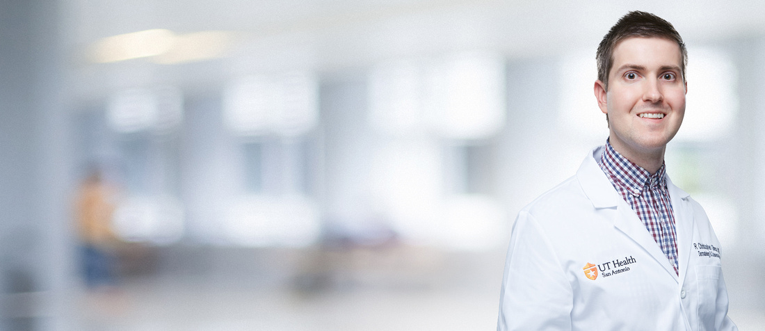 A headshot of Dr. Robert Christopher Gilson in his white coat