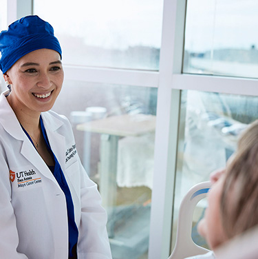 a doctor talking to a patient 