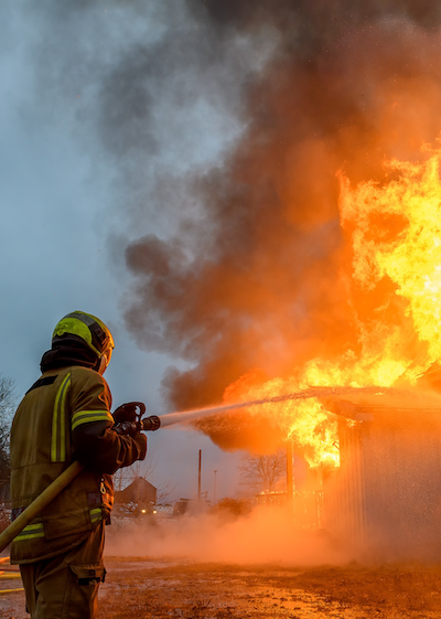 Firefighters extinguishing a house fire