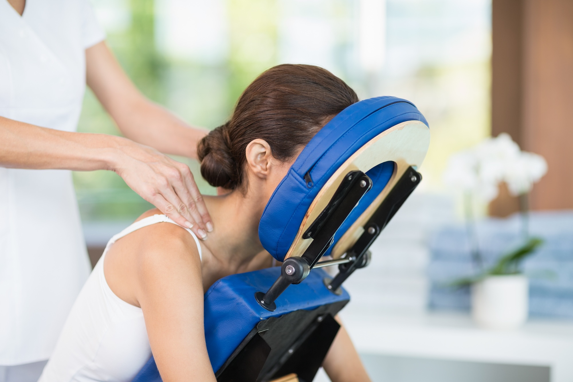 Woman in chair getting massage