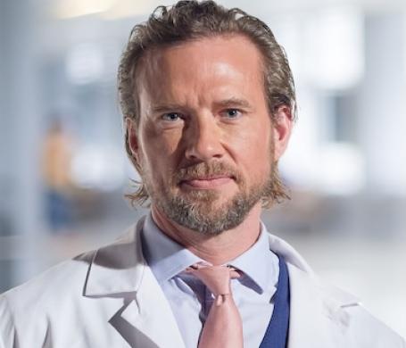 Dr. Fries in his white coat